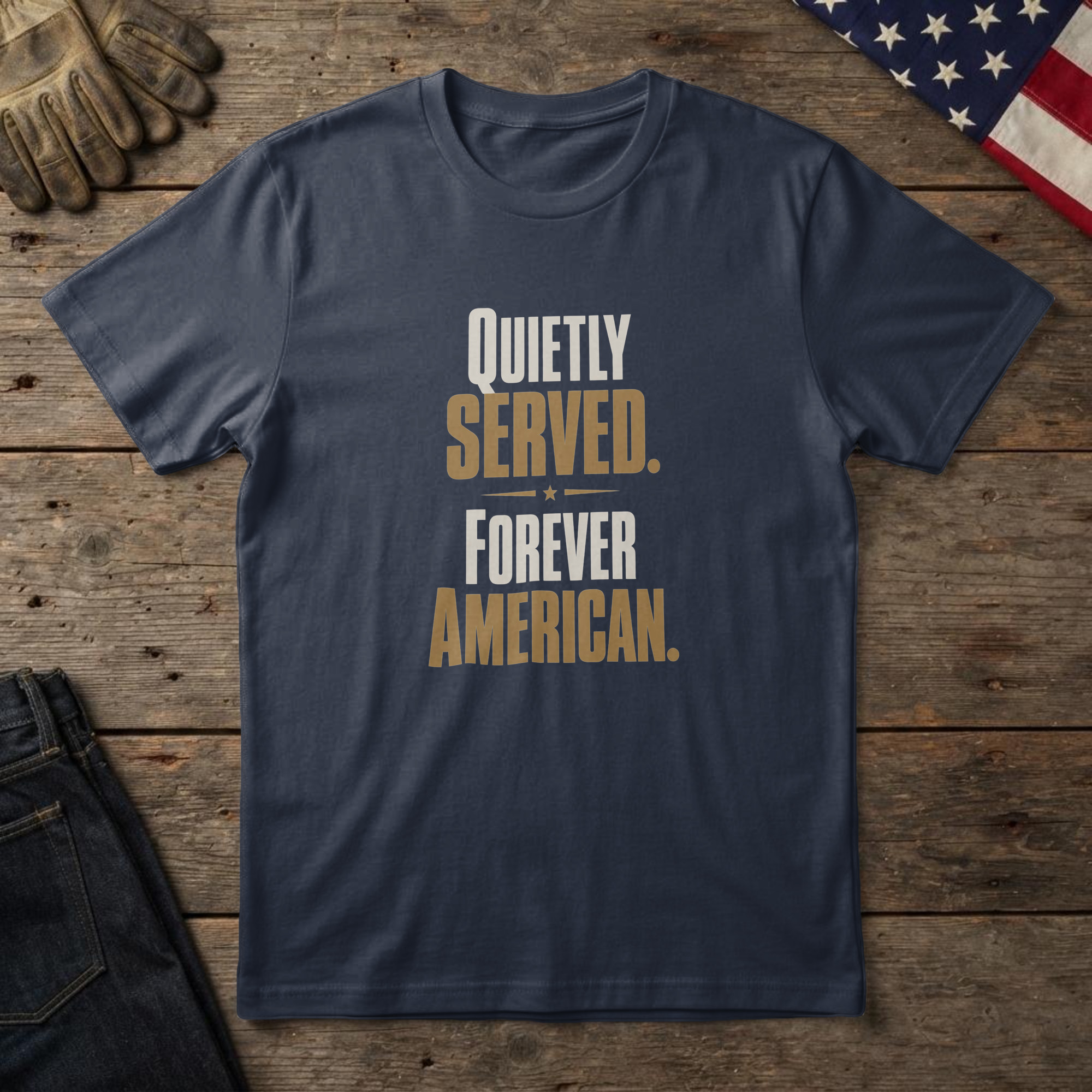 lfb-hero-13585 Navy t-shirt with clean type and a small flag and the words "Quietly Served. Forever American." on wood with a flag