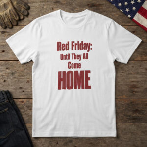 White t-shirt with bold red type reading "Red Friday: Until They All Come Home" on wood with a US flag