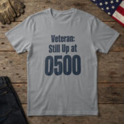 Sport Grey t-shirt with bold navy type reading "Veteran: Still Up at 0500" on wood with a US flag