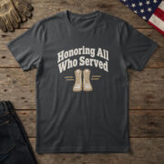 Black t-shirt with line-art combat boots under "Honoring All Who Served" on wood with a US flag