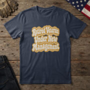 Navy blue t-shirt with cream and gold groovy retro type reading "Retired Veteran: Under New Management", on wood with a flag