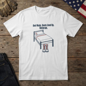 White t-shirt with navy line art of a made bed with boots at its foot and the words "Bed Made. Boots Lined Up. Veteran."