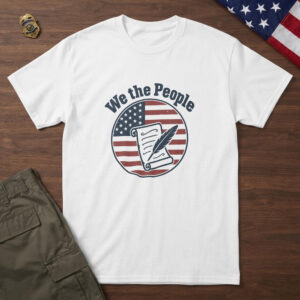 White t-shirt with an unrolled parchment and a quill pen on a flag-stripe badge and the words "We the People", on walnut