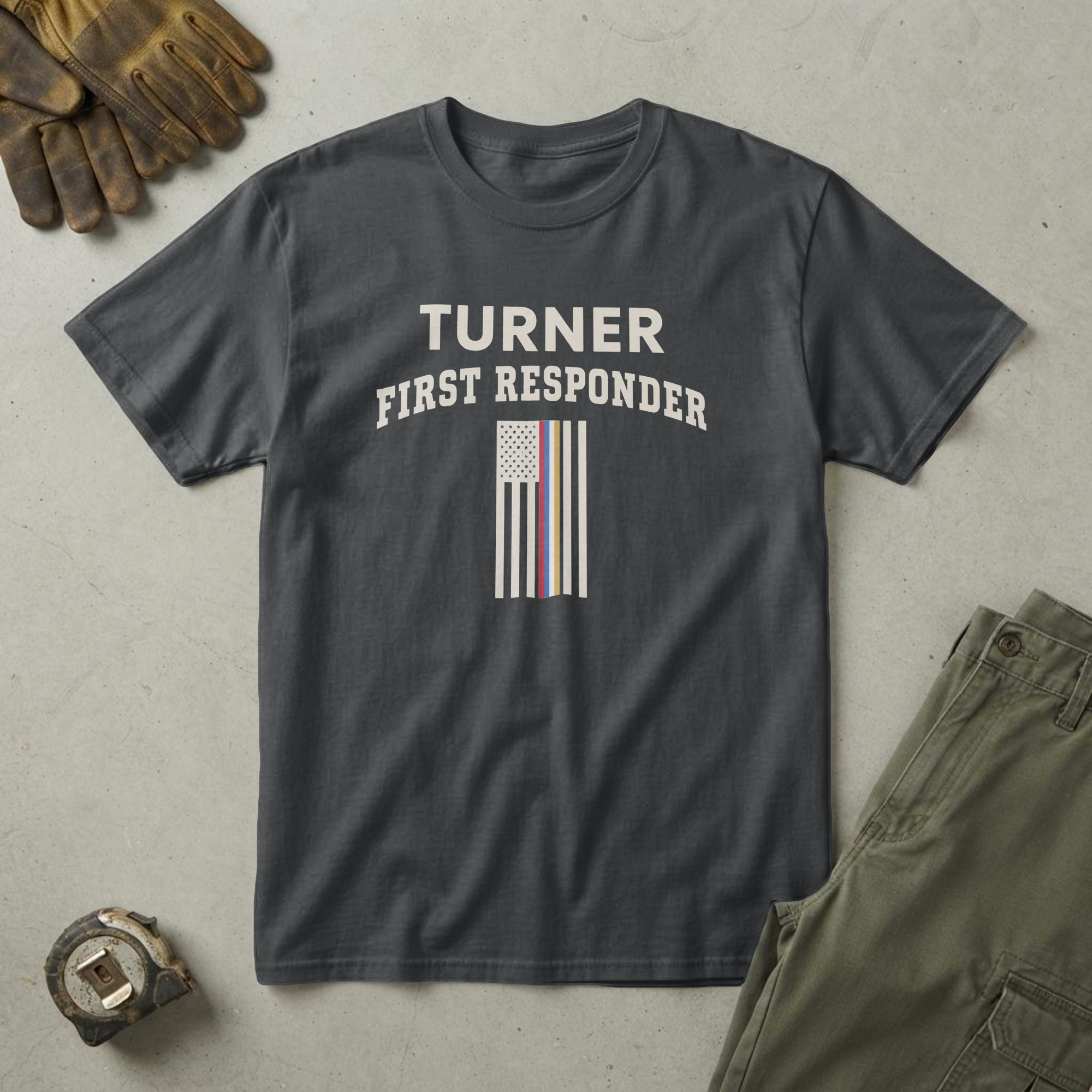 lfb-hero-15161 Black t-shirt with the words "TURNER FIRST RESPONDER" over a small flag with red, blue, white and gold stripes